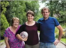  ??  ?? Teacher and Ireland rugby captian Ciara Griffin pictured with her parents Kathleen and Denis at home on the family farm near Ballymacel­ligott, Tralee. Photo: Don MacMonagle