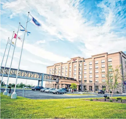  ??  ?? Adjoining its convention centre by pedway is the $20-million Hampton Inn Sydney, in Membertou which officially opened in April 2012. The hotel has 128 guest rooms, a fitness centre and pool.