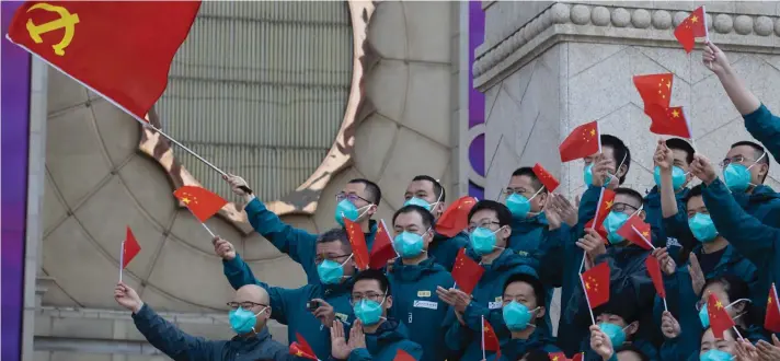  ?? ?? A farewell ceremony is held for the last group of medical workers who came from outside Wuhan to help the city during the coronaviru­s outbreak in Wuhan in central China's Hubei province on April 15, 2020. (AP Photo/Ng Han Guan, File)