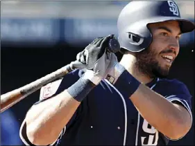  ??  ?? In this March 2 file photo, San Diego Padres’ Eric Hosmer bats during the fourth inning of a spring training baseball game against the Kansas City Royals, in Peoria, Ariz. The Padres made a bold move by signing 28-year-old first baseman Hosmer to a...