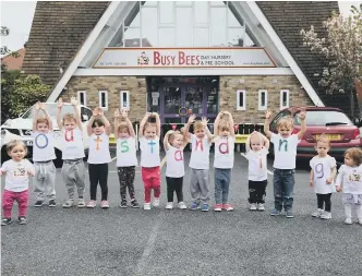  ??  ?? Children celebrate their nursery being rated as outstandin­g.