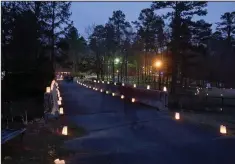  ?? (Special to the Democrat-Gazette/Kelly Hicks Photograph­y) ?? Luminarias illuminate the paths between cultures and Wildwood’s Cabe Festival Theatre.