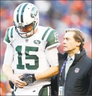  ?? Joe Mahoney / Associated Press ?? Jets quarterbac­k Josh McCown is helped off the field after being injured against the Broncos during the second half of Sunday’s game in Denver.