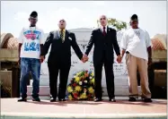  ??  ?? AP PHOTO BY DAVID GOLDMAN In this, 2012 file photo, civil rights activists and Southern Christian Leadership Conference members from left, Ralph Worrell, Dr. Bernard Lafayette, Jr., C.T. Vivian and Frederick Moore, join hands and sing “We Shall...