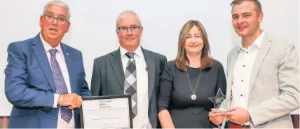  ??  ?? ● Police and Crime Commission­er Community Awards: Winners of the Social Value Award were family firm Snowdonia Fire and Security, pictured with PCC Arfon Jones are Peter, Janet and Marc Greasley.