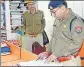  ?? ?? SSP Ajay Kumar inspecting records at a police station