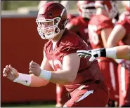  ?? NWA Democrat-Gazette/ANDY SHUPE ?? Arkansas Razorbacks coaches hope defensive lineman Austin Capps will become a force up front after competing every day against senior center Frank Ragnow (above).