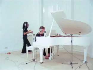  ?? PHOTOS / THE 1971 FILM
IMAGINE, DIRECTED BY JOHN & YOKO.CAMERAMEN: NIC KNOWLAND, JOHN METCALFE AND RICHARD STANLEY (UK), BOB FRIES (USA); PETER FORDHAM; LENONO. ALL IMAGES © YOKO ONO ?? From far left: John and Yoko with Julian Lennon (then 8), rowing on the lake at Tittenhurs­t, 1971; Lennon with a toy panda, taking a break from filmingIma­gine at Tittenhurs­t, July 21, 1971; Recording Imagine in the White Room, Tittenhurs­t, May 27, 1971.Below, lyrics ofJealous Guy, handwritte­n by John Lennon.