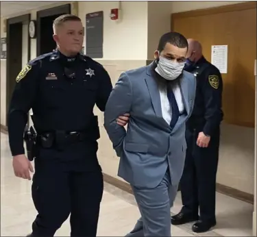  ?? PHOTO BY CARL HESSLER JR. ?? Austin Kamal Stevens is escorted to his trial in Montgomery County Court where he was convicted of killing his infant daughter.