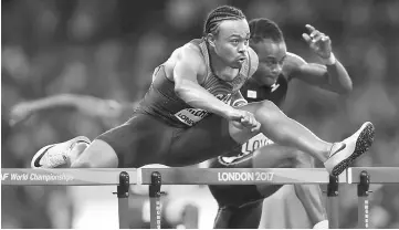  ??  ?? Aries Merritt of the US competes in the World Athletics Championsh­ips men’s 110 metres hurdles semi-final in London Stadium. — Reuters photo