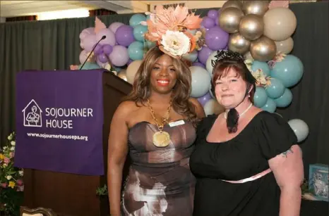  ?? John Colombo/For the Post-Gazette ?? Sojourner House Executive Director De'netta Benjamin-Miller, left, with former Sojourner House resident Heather Spencer during the annual Victorian Tea fundraiser Sunday at the Omni William Penn Hotel in Downtown.