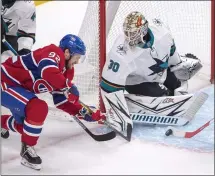  ?? RYAN REMIORZ — THE CANADIAN PRESS VIA AP ?? Sharks goaltender Aaron Dell, right, stops Canadiens left wing Jonathan Drouin during Thursday night’s game in Montreal. For a report on the game and more on the Sharks, please go to MERCURYNEW­S.COM/SPORTS