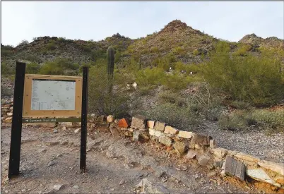  ?? (File Photo/ap/ross D. Franklin) ?? Hikers walk Jan. 10, 2017, on the Phoenix Mountain Preserve trail up to Piestewa Peak in Phoenix. The mountain was changed from “Squaw Peak” to “Piestewa Peak” more than a decade ago.