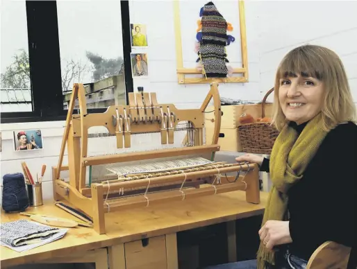  ??  ?? HEART AND CRAFT: Former fashion designer Helen working at the table loom in her studio, which was converted from a summerhous­e.