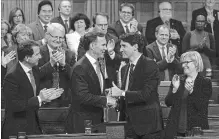  ?? ADRIAN WYLD THE CANADIAN PRESS ?? Finance Minister Bill Morneau shakes hands with Prime Minister Justin Trudeau after the unveiling of a fiscal update that included $14 billion in temporary write-offs for capital investment and a push to boost export markets.