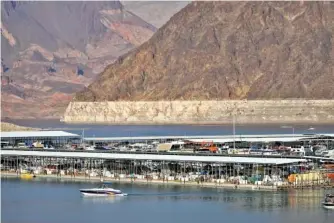  ?? AP PHOTO/JOHN LOCHER ?? A bathtub ring of light minerals delineates the high water mark on Lake Mead at the Lake Mead National Recreation Area near Boulder City, Nev., in August.