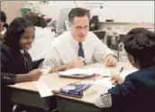  ?? Mary Altaffer Associated Press ?? MITT ROMNEY, who campaigns to mostly white audiences, visits with black students in Philadelph­ia.