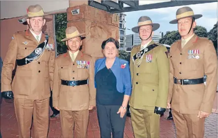  ??  ?? Claire Clark with members of a Gurkha company, in New Zealand for World War I commemorat­ions, who attended the exhibition’s opening. From left, major Mark Shields, warrant officer Lalit Gurung, Claire Clark, captain James Harryman, corporal Sojit...