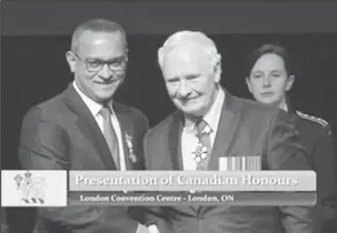  ??  ?? Dr. Narendra Singh (left) receiving congratula­tions from Governor General David Johnston following the Meritoriou­s Service Decoration presentati­on (CNW Group/Humber River Hospital)