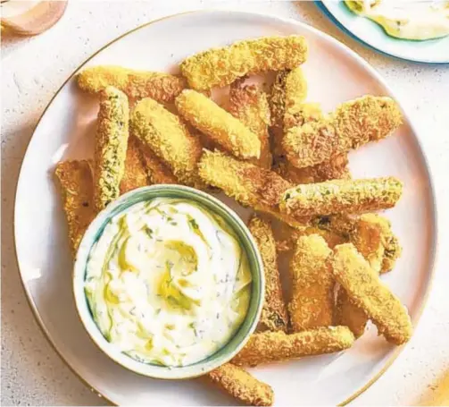  ?? JOE LINGEMAN/THEKITCHN.COM ?? Zucchini with an impossibly crispy, crunchy exterior without deep-frying? Yes, please.