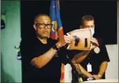  ?? JOHN T. GREILICK — DETROIT NEWS FILE ?? Detroit Police Chief James Craig shows a photograph of the handgun used by a man who shot at police officers at close range while they were arresting his friend.