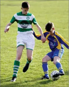  ??  ?? Eoin Gahan (St. Joseph’s) taking on Darragh Farrell (Shamrock Rovers) in the Under-15 Cup final in Castlebrid­ge on Saturday.