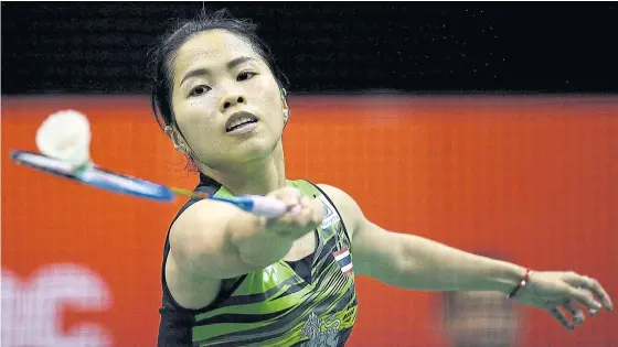  ??  ?? Ratchanok Intanon is a picture of poise as she hits a return to Akane Yamaguchi during their semi-final match yesterday.