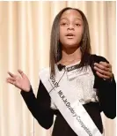  ??  ?? ABOVE: Mia Roberts, from Dixon Elementary School, speaks during the first MLK Jr. Oratory Competitio­n. She won first place.