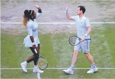  ?? KIRSTY WIGGLESWOR­TH/ASSOCIATED PRESS ?? United States’ Serena Williams high-fives Andy Murray after winning a mixed doubles match against Alexa Guarachi and Andreas Mies during Wimbledon on Saturday.