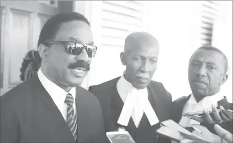  ??  ?? Attorney General Basil Williams (at left) along with Queen’s Counsel Hal Gollop (centre) and Queen’s Counsel Ralph Thorne, speaking with reporters after the judgment.