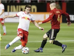  ??  ?? ATLANTA: Midfielder Alex Muyl #19 of the New York Red Bulls dribbles in front of defender Greg Garza #4 of Atlanta United during the game at Bobby Dodd Stadium on Sunday in Atlanta, Georgia. — AFP