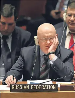  ?? Pictures: Getty Images. ?? Top: Prime Minister Theresa May during a visit to Salisbury, where the poison attack took place. Above: Russia’s ambassador to the United Nations, Vassily Nebenzia, listens to the debate at the UN Security Council.