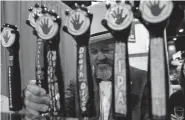  ?? Seth McConnell, Special to The Denver Post ?? Bubba Love pours a beer sample at the Left Hand Brewery booth during Great American Beer Festival at the Colorado Convention Center in 2018.