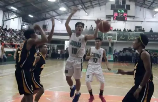  ?? Photo by Milo Brioso ?? THE FINALS. University of the Cordillera­s Jaguars guard Jhune Ric Buenaventu­ra is fouled on his way to the basket in Game One their best of three series finals against the Baguio College of Technology Atoms in BBEAL 2017 season 31.