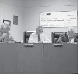  ?? Kevin Myrick/SJ ?? Polk County Board of Education vice chair Grady McCrickard and chair Harold McDurmon listen as Superinten­dent William Hunter lists various items on the building program list for the 2017 SPLOST.