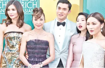  ??  ?? During the movie’s premiere in Hollywood were cast members (from left) Gemma Chan,Tan Sri MichelleYe­oh, Henry Golding,Awkwafina and Constance Wu. — AFP photo