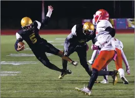  ?? CHRIS RILEY — TIMES-HERALD, FILE ?? Bethel quarterbac­k Mal Turner flies through the air as he runs for a first down during a 2019 win over Vallejo in the battle for the Mayor’s Cup.