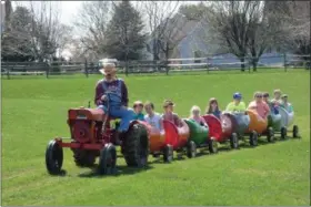  ?? SUBMITTED PHOTO - KAYLEE LINDENMUTH ?? Children’s barrel car train rides were a popular attraction at the Kutztown Easter on the Farm event on April 13.