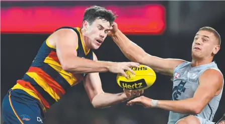  ?? Picture: AAP/DAVID MARIUZ ?? Adelaide forward Mitch McGovern (left) has joined Carlton on a busy AFL off-season trading day.