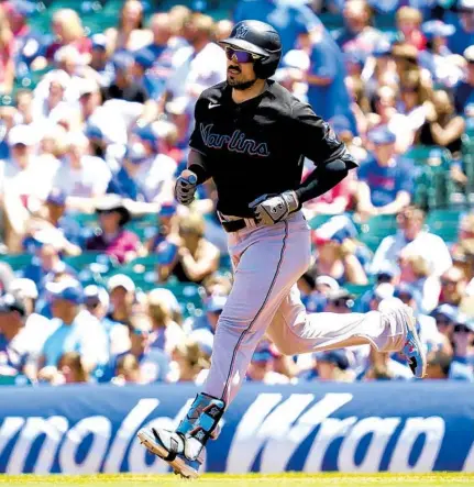  ?? NAM Y. HUH/AP ?? The Marlins’ Adam Duvall rounds the bases after hitting a two-run home run in the first inning Saturday in Chicago.