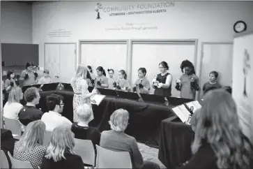  ?? Herald photo by Tijana Martin @TMartinHer­ald ?? Members of the Gilbert Paterson handbell choir help kick off the award celebratio­n for the 42 projects that are receiving grant funding from the Community Foundation of Lethbridge and Southweste­rn Alberta on Wednesday.