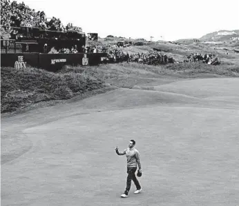  ?? PAUL ELLIS/GETTY-AFP ?? Rory McIlroy walks off the 18th green Friday at Royal Portrush. The Northern Ireland native shot a 65 but missed the cut.