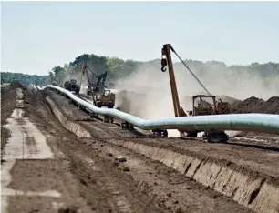  ?? Bloomberg ?? The Flanagan South crude oil pipeline outside Goodfield, Illinois. The approximat­ely 600-mile, 36inch pipeline will originate in Flanagan, Illinois, and terminate in Cushing, Oklahoma, where US crude futures are delivered. —