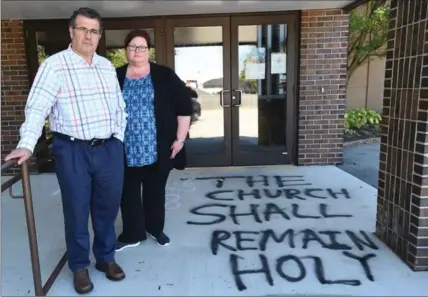  ?? PETER LEE, RECORD STAFF ?? Rev. Joe Gaspar, left, and Rev. Heather Power are considerin­g “taking what was potentiall­y an act of hate and making it an act of love.”