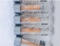  ?? THE CANADIAN PRESS/DOUGLAS BEVANS ?? Bottles of Hot Dog Water sold in Vancouver were part of an art performanc­e, according to the artist.