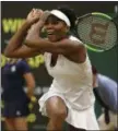  ?? ALASTAIR GRANT — ASSOCIATED PRESS ?? Venus Williams returns to Jelena Ostapenko during their women’s quarterfin­al singles match at Wimbledon.