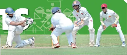  ?? ?? Shannon Fernando, who scored 64 for St. Peter's against Ananda, makes an elegant sweep - Pix by Ranjith Perera