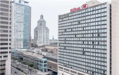  ?? MARK MIRKO PHOTOS/HARTFORD COURANT ?? The Hilton Hartford on Trumbull Street stands across Church Street from the XL Center arena in downtown Hartford. The aging hotel, dependent on business travel and convention group bookings, was hit hard by the pandemic.