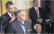  ??  ?? FRIEND OF MARTIN LUTHER: Barack Obama presents the Medal of Freedom to Joseph Lowery during a ceremony at the White House.