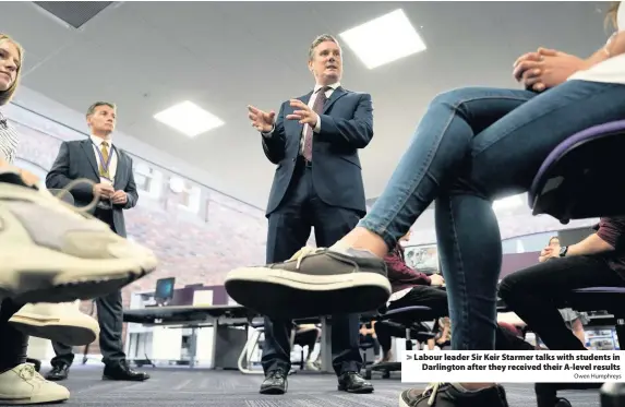  ?? Owen Humphreys ?? > Labour leader Sir Keir Starmer talks with students in Darlington after they received their A-level results